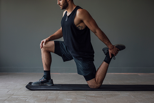 man stretching legs | muscle imbalance