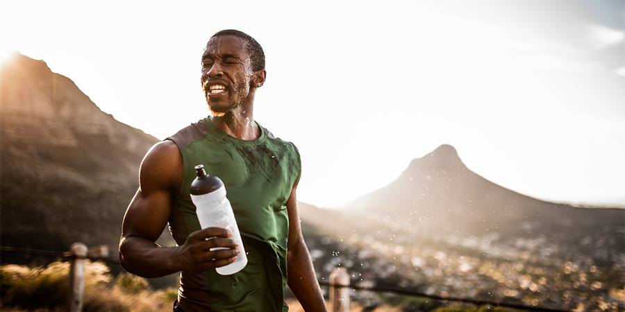 sweaty athlete hydrating | how to prevent dehydration