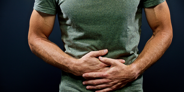 man holding his stomach | gut health fitness