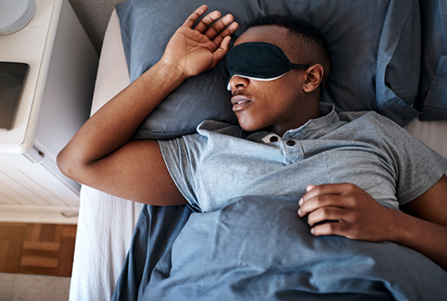 man sleeping with sleep mask | how to increase energy