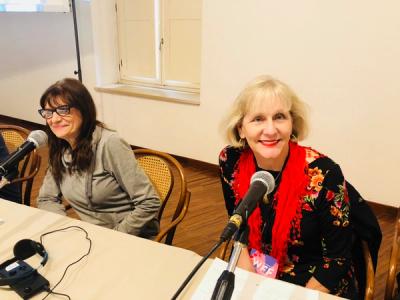 picture of marty and another woman sitting next to one another at a writing conference