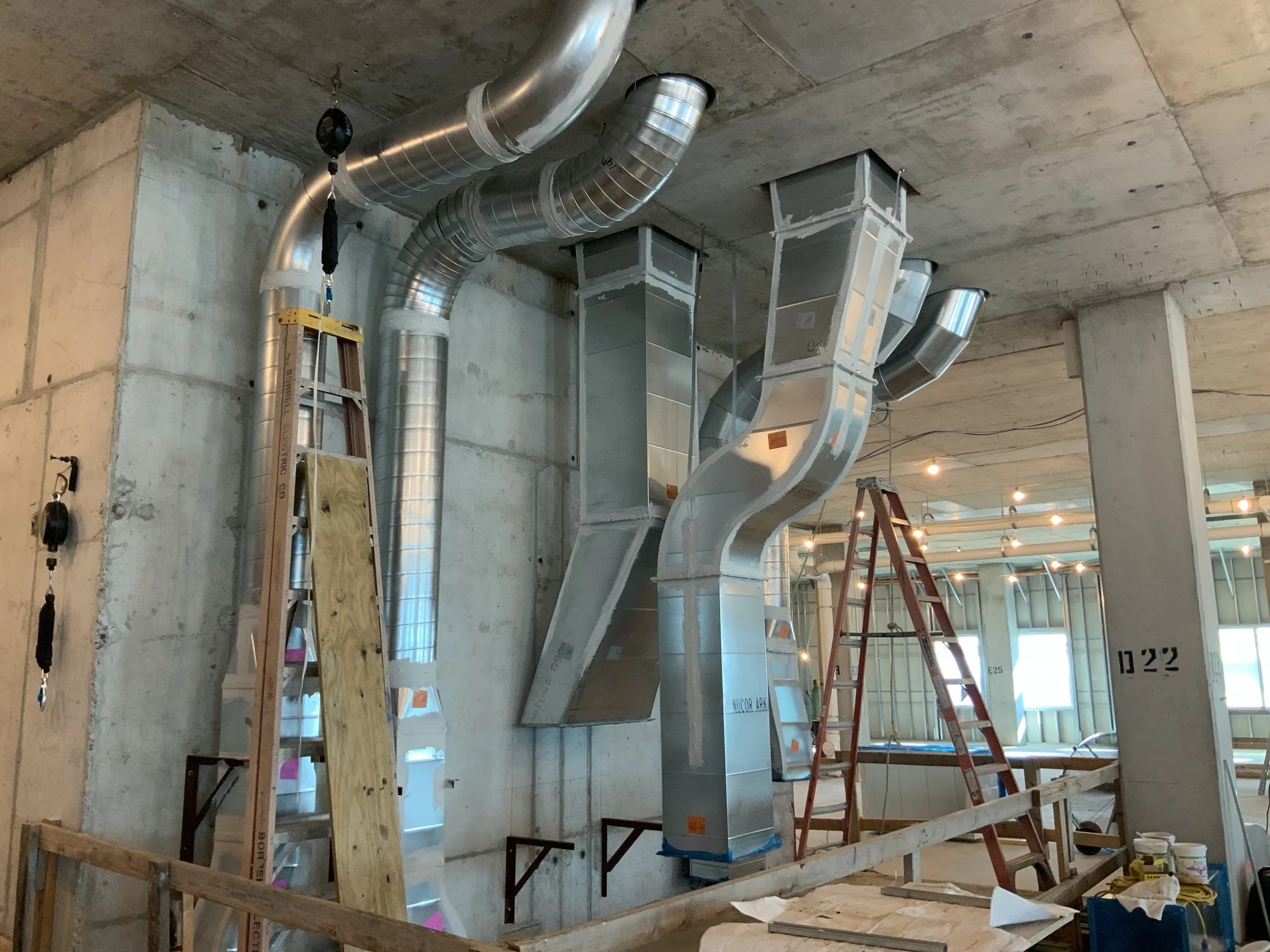 Round and rectangular sheet metal ductwork with formed offsets and transitions during installation at BayCare Manatee