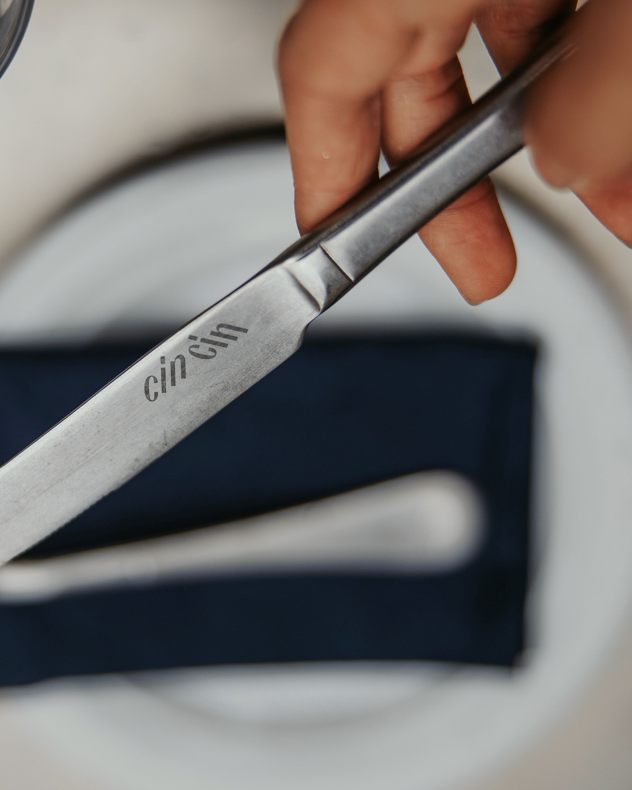 logo on knife fine dining branding