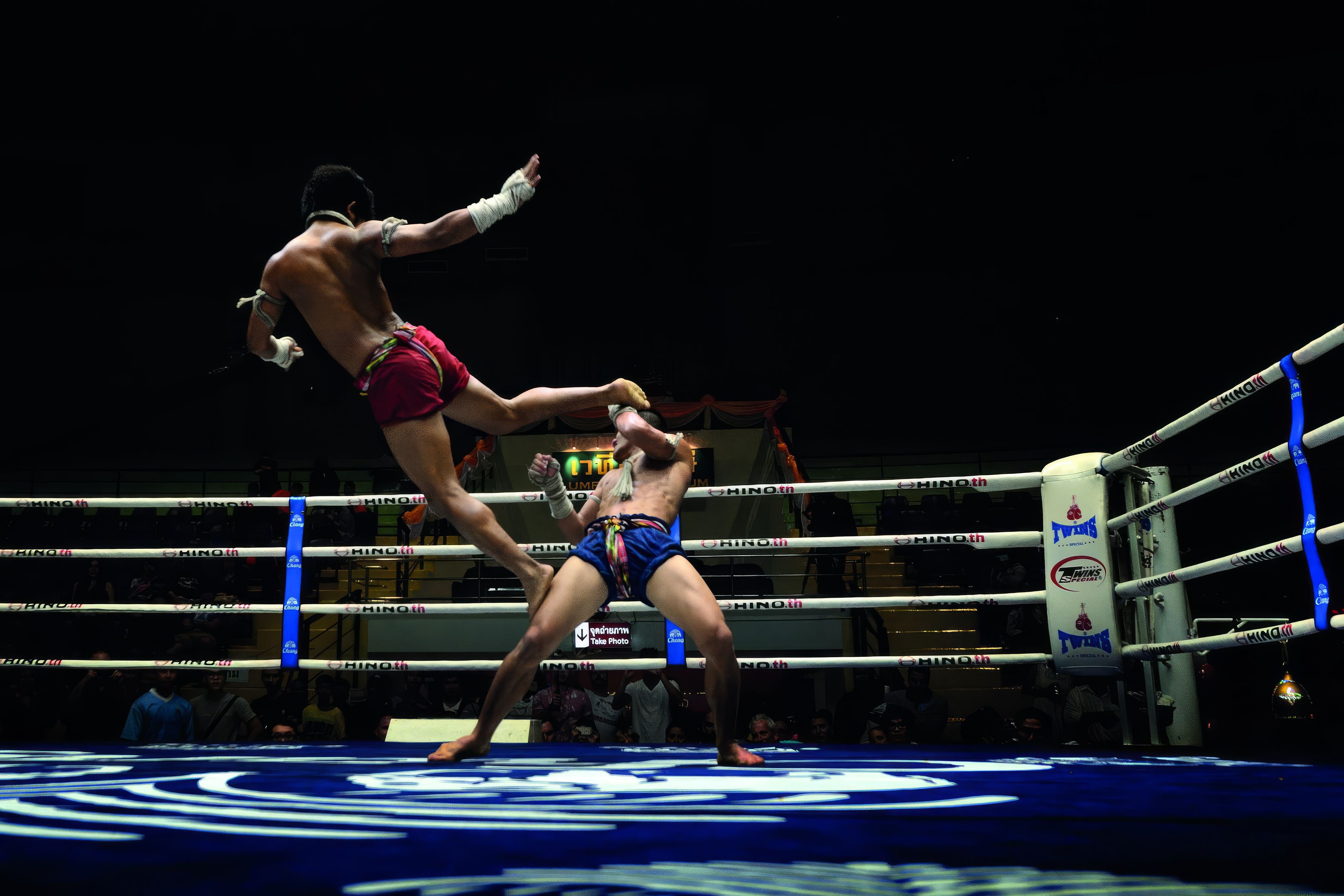 Lumpinee Stadium in Bangkok on a fight evening.
