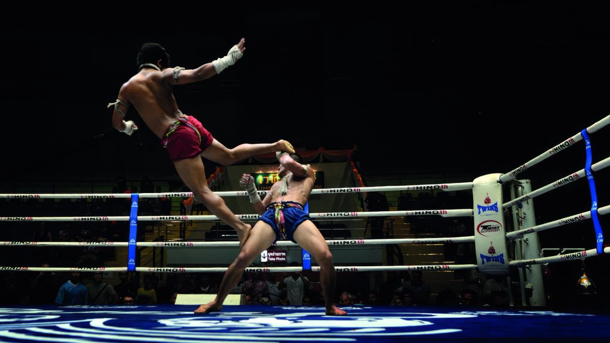 Lumpinee Stadium in Bangkok on a fight evening.