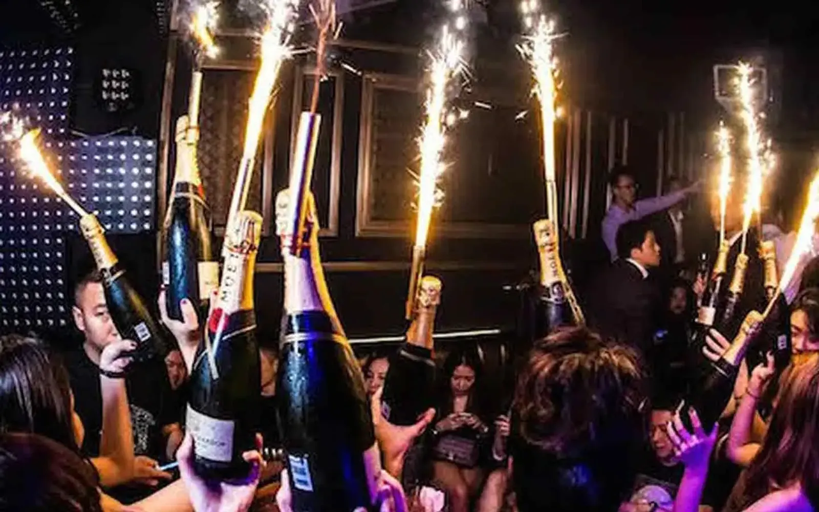 Champagne open in the group's own VIP section after dark