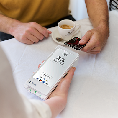 Eftpos terminal and coffee cup