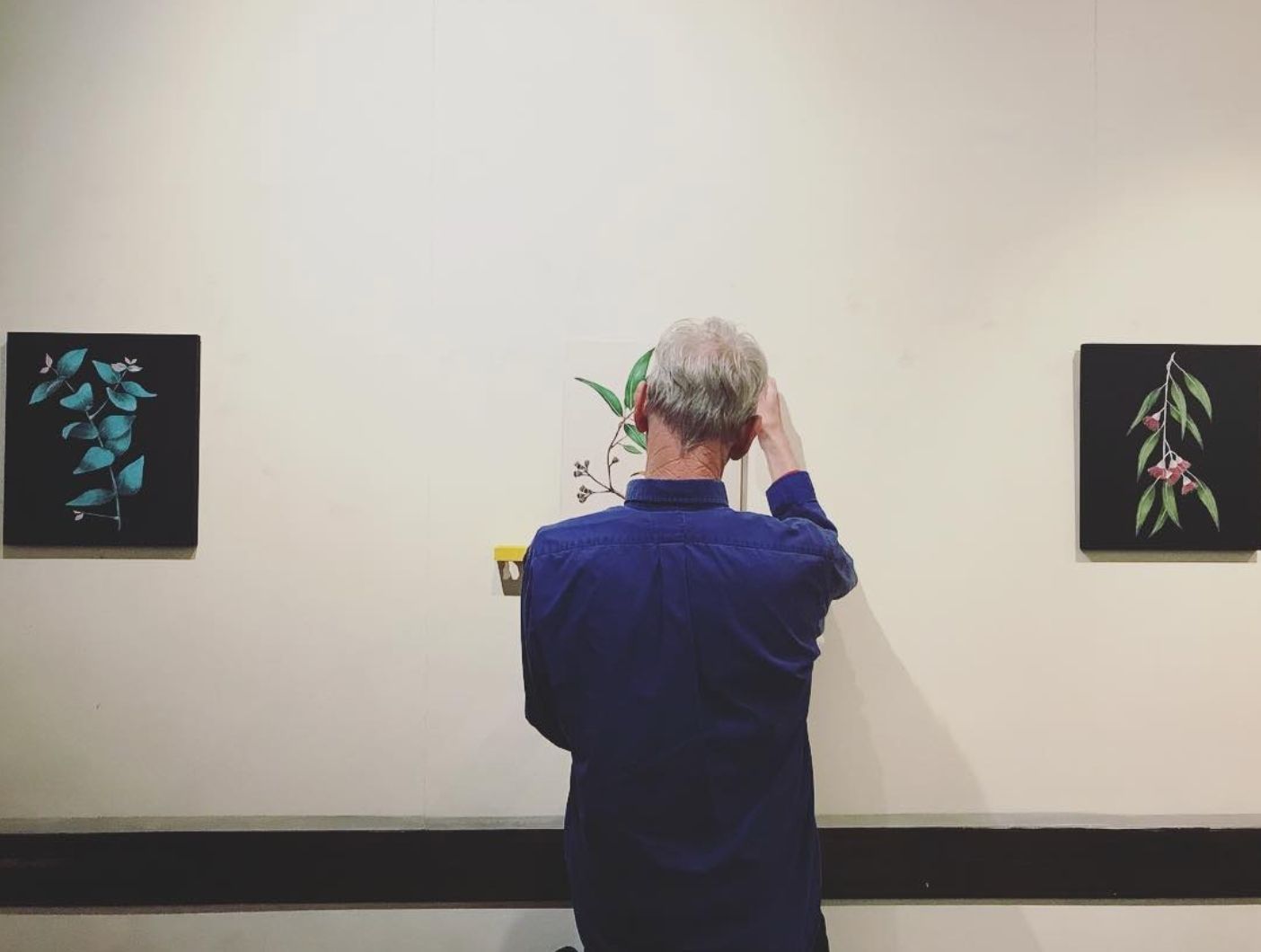 Hanging art on the walls at Marios