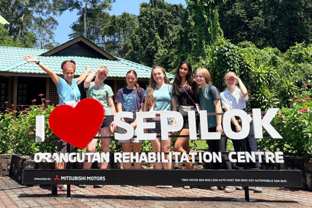 Cobham Hall students stood in front of the Sepilok Orangutan Rehabilitation Centre on their World Challenge expedition to Borneo.