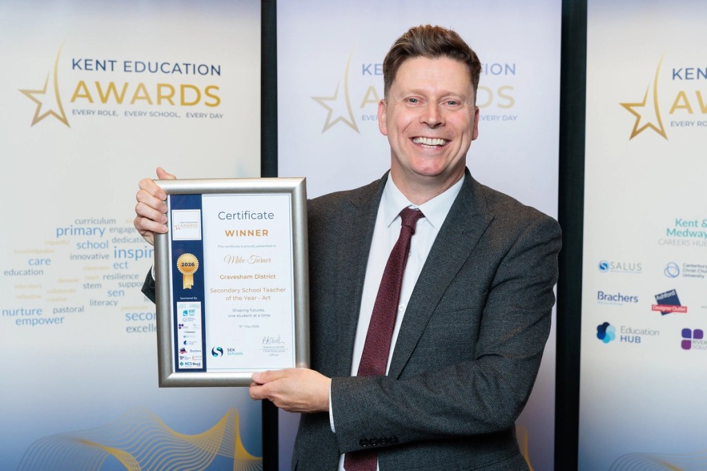 Celebrating success at the Kent Education Awards: our Art teacher, Mr Turner, proudly displays the Secondary School Teacher of the Year – Art award.