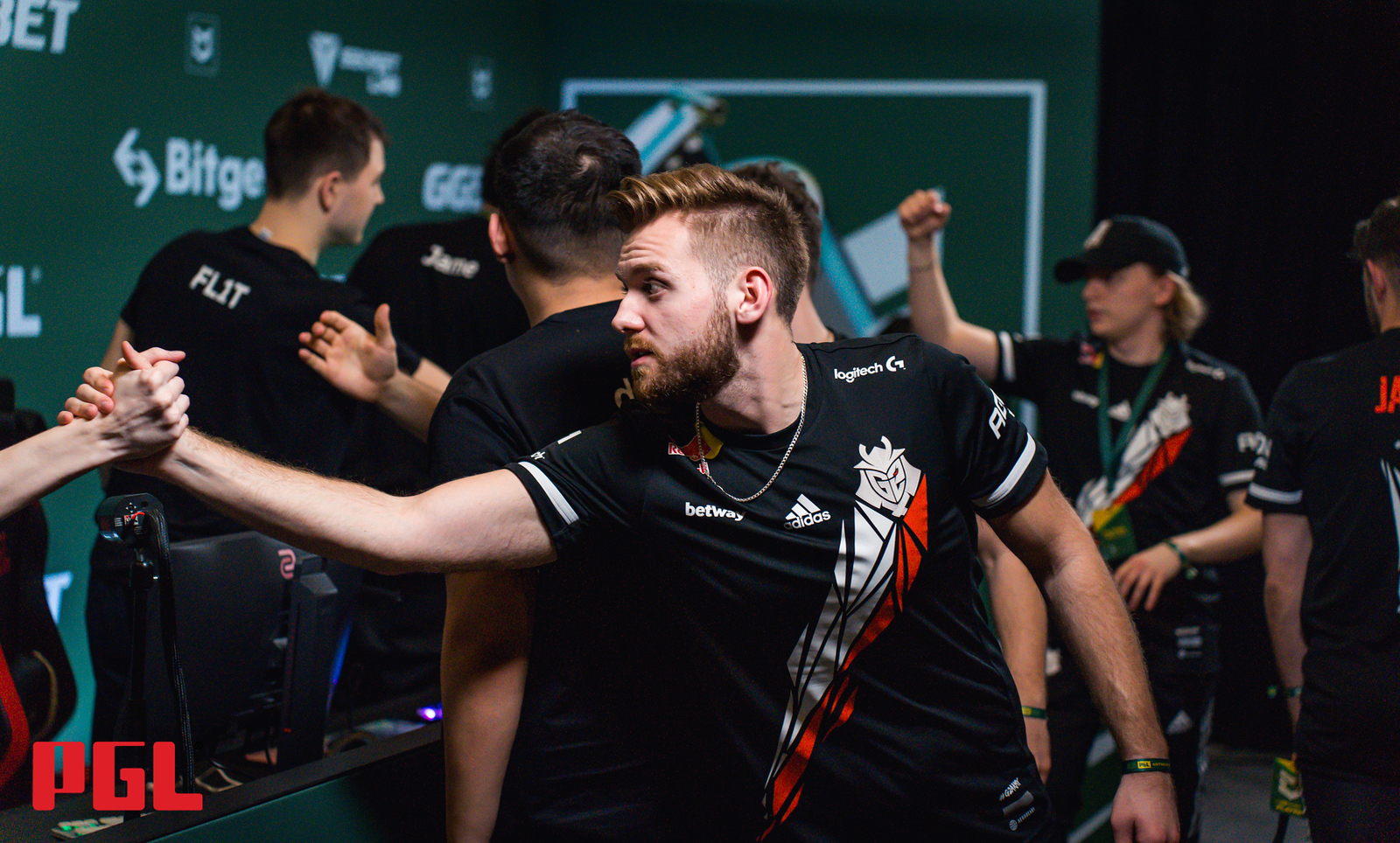 G2 players shake hands with their opponents at the end of a game of CS:GO at the Antwerp Major 