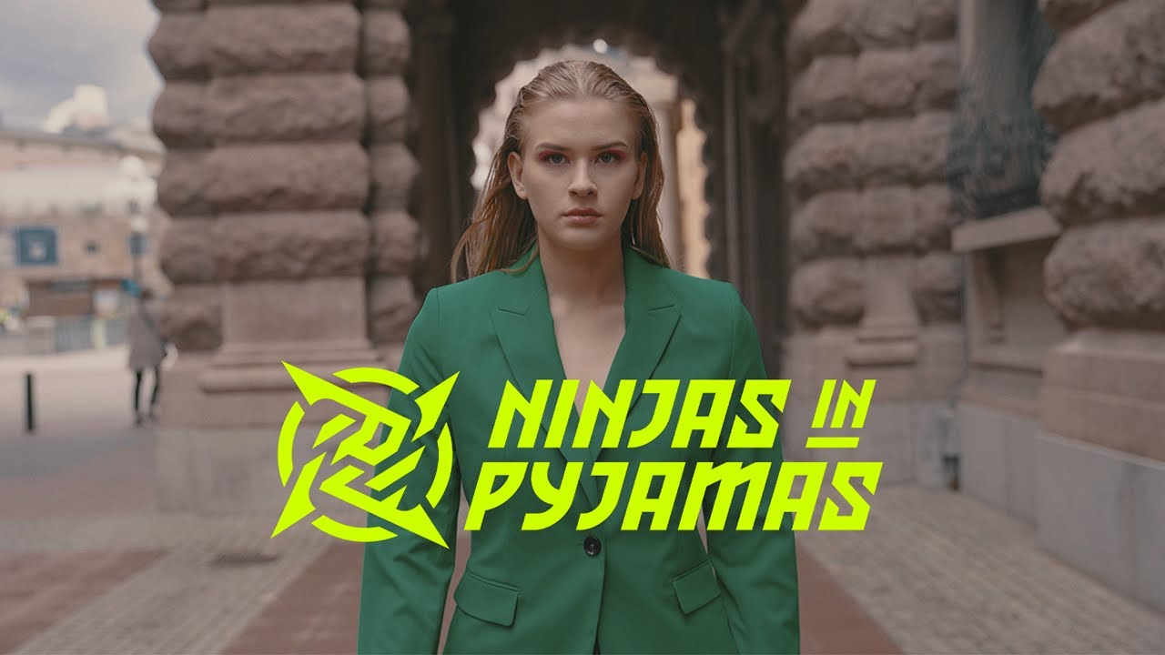 Tilde "7licious" Byström walks down a city street in a green blazer in a promotional image for her team, Ninjas in Pyjamas one of the organizations who field a female CS:GO roster