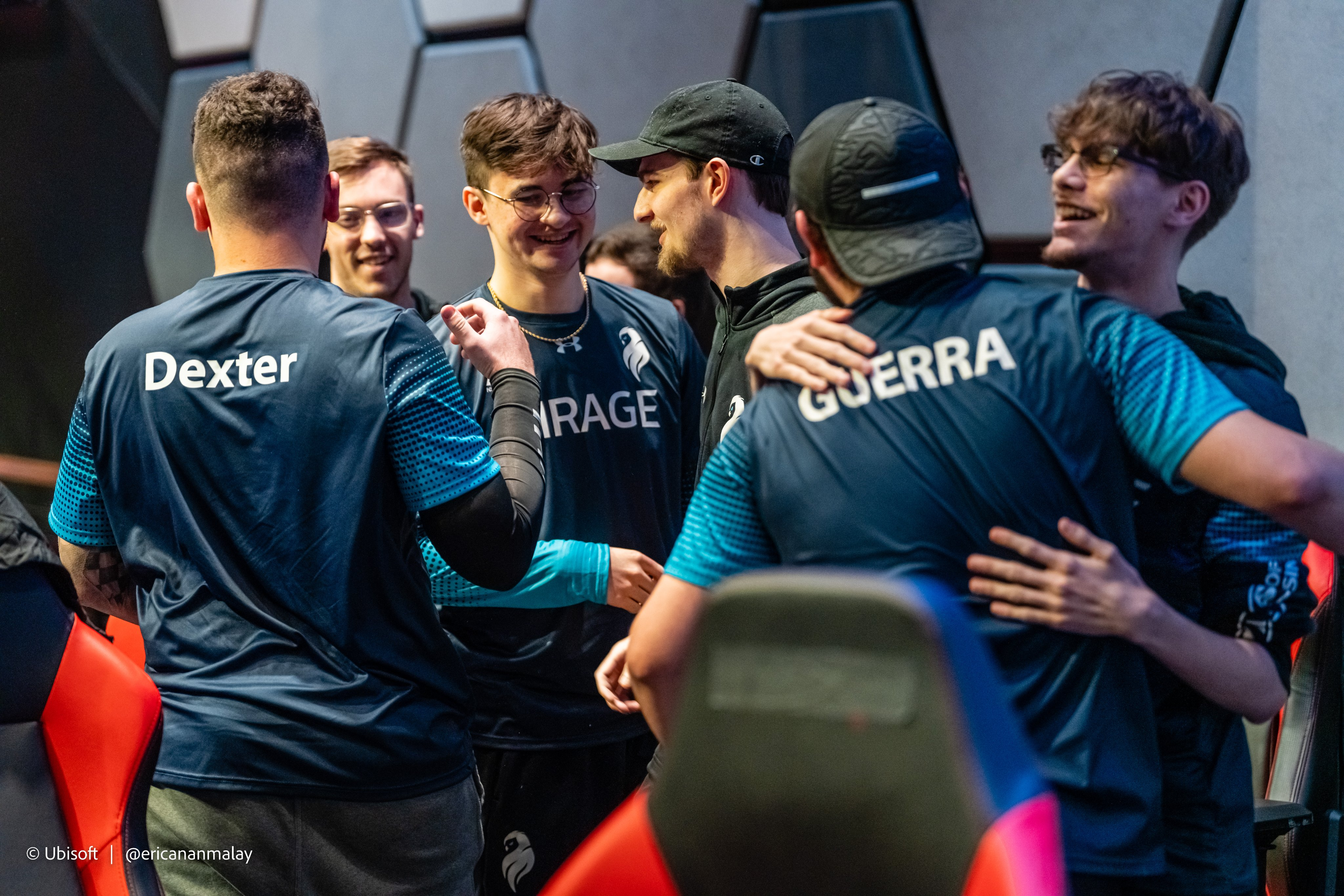 The R6 roster for Mirage celebrate in the booth together after a win
