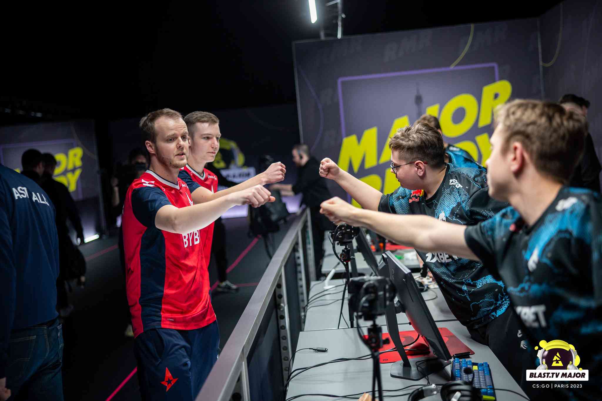 Xyp9x and his teammates bump fists with their opponents after a game of CS:GO in the EU RMR B for the BLAST Paris Major 2023