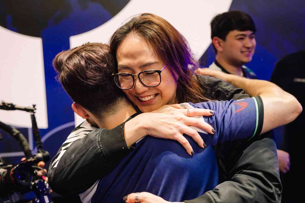 EG head coach Potter and Ethan Arnold hug onstage after defeating C9 in the 2023 VCT Americas League playoffs. Credit: Stefan Wisnoski/Riot Games