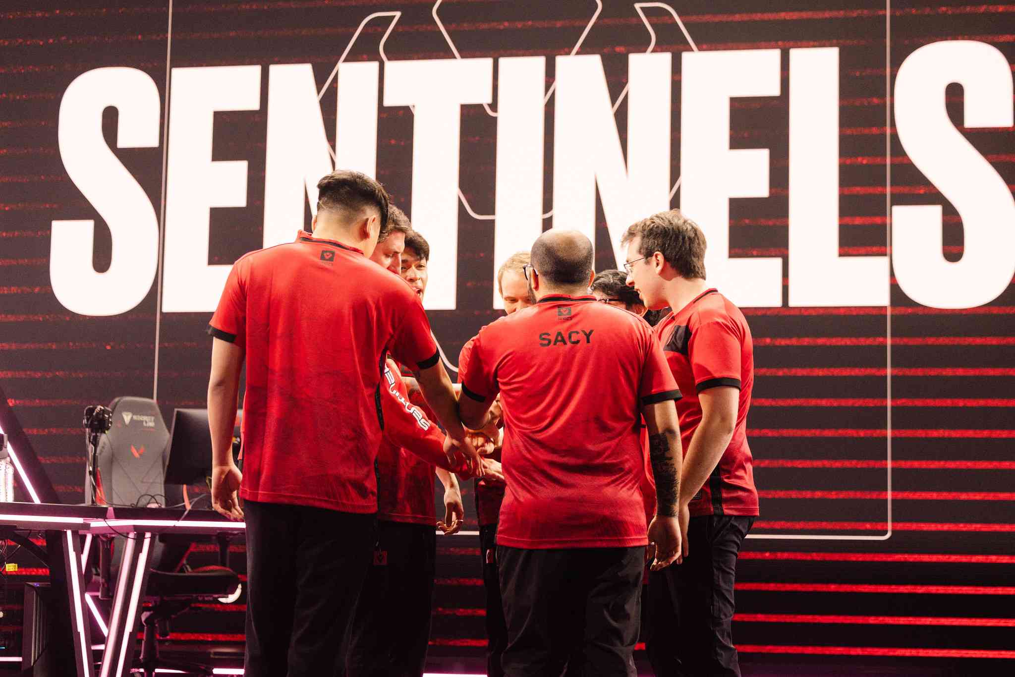Members of Sentinels huddle before their match against MIBR during Super Week in the 2023 VCT Americas League season (Image via Colin Young-Wolff/Riot Games)