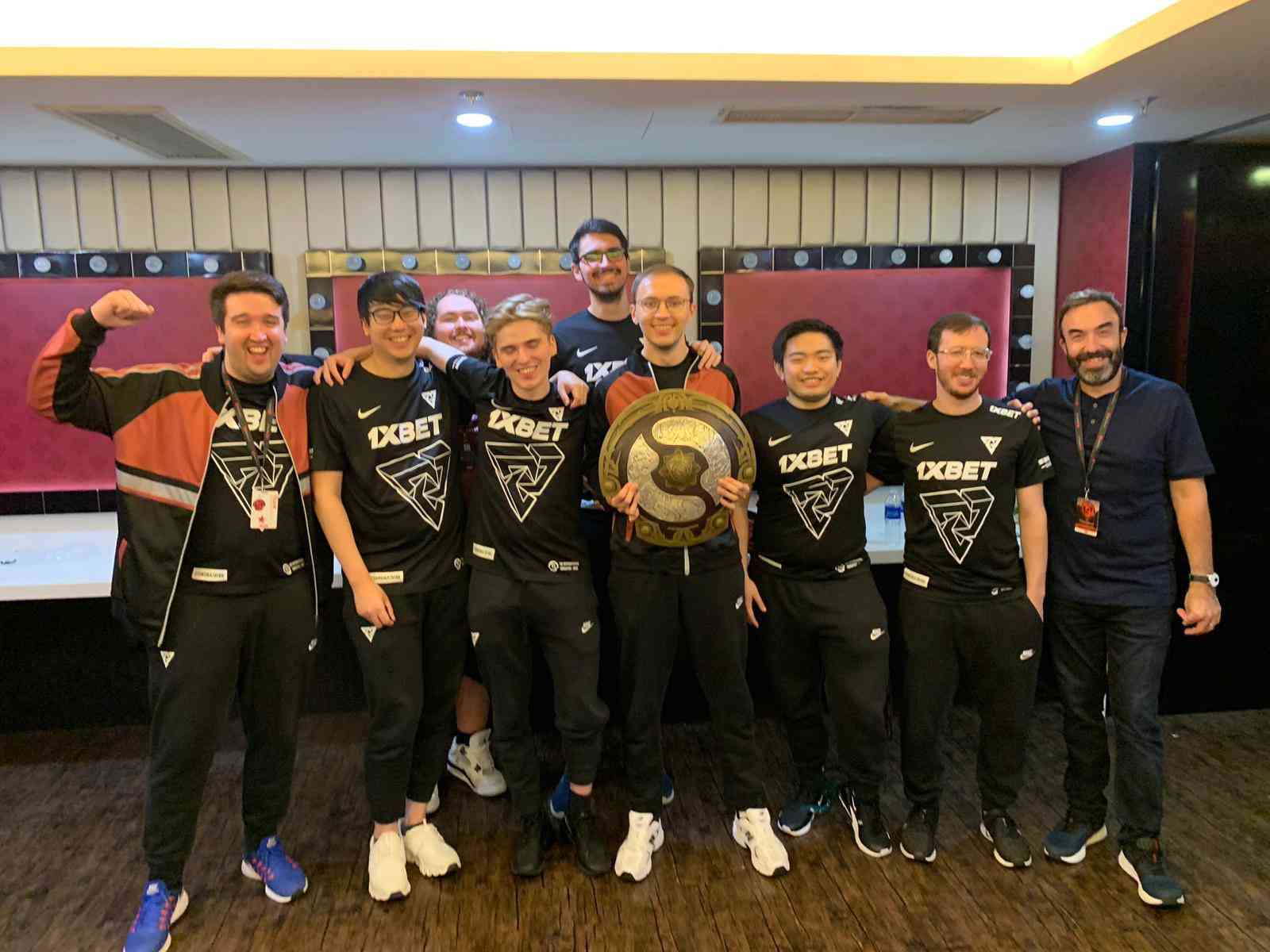 Abrahams with the rest of Tundra Esports and the aegis after their win at TI 11