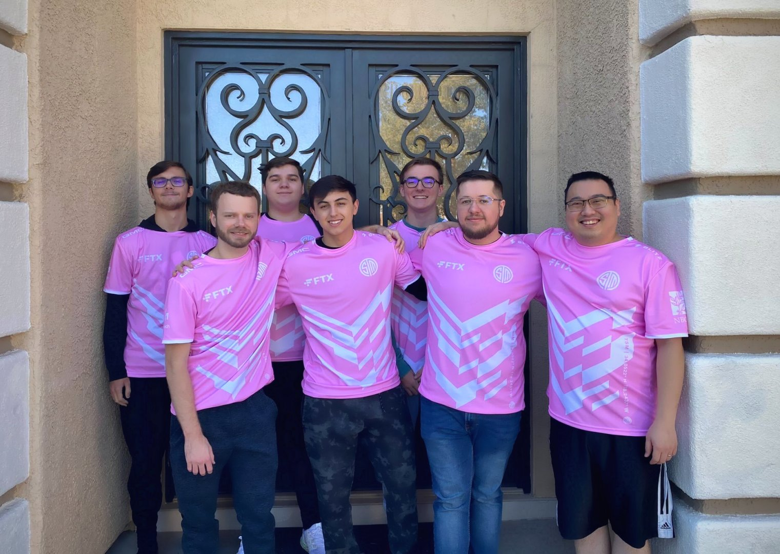The R6 roster for TSM stand together in their pink jerseys