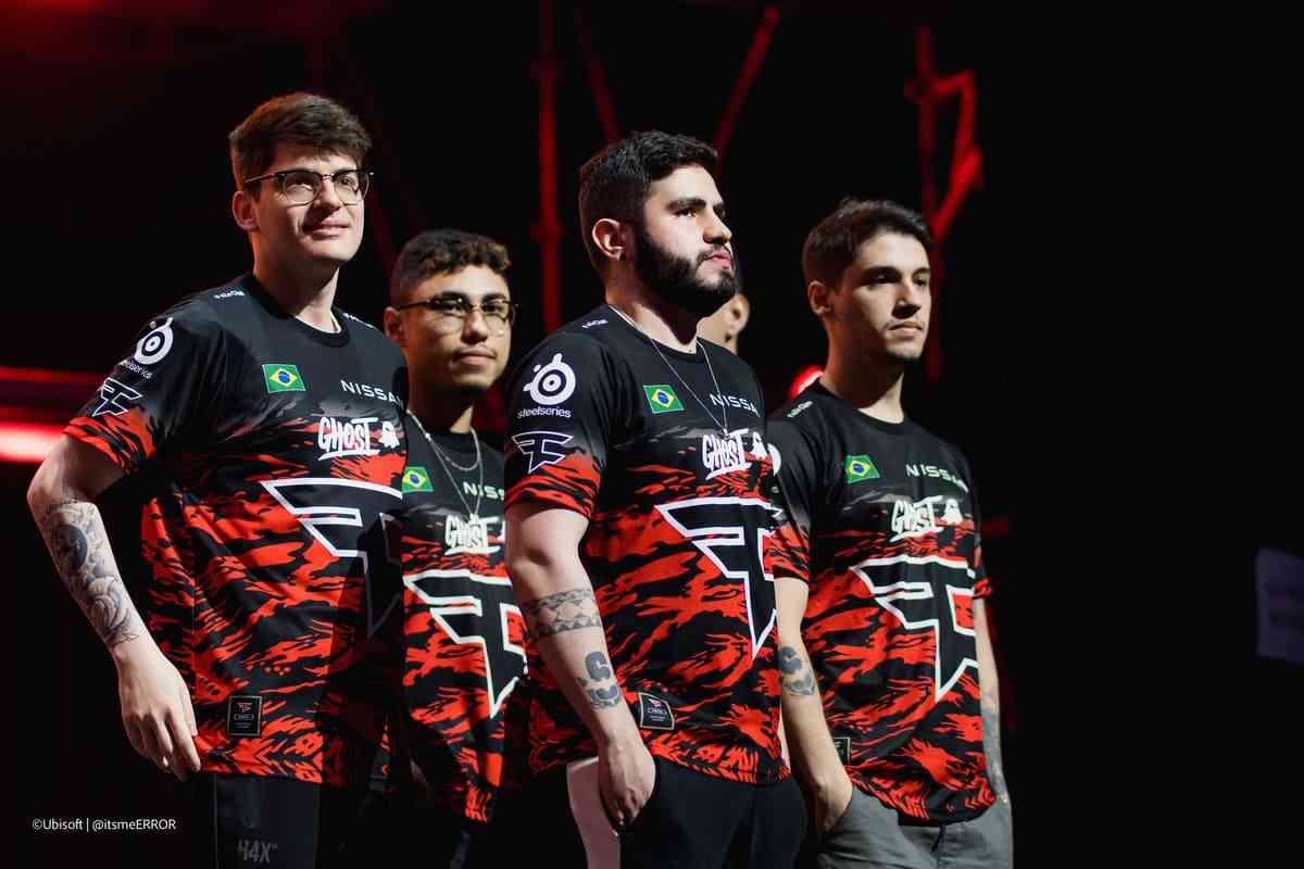 The Rainbow Six roster for FaZe Clan stand on stage at a LAN event.