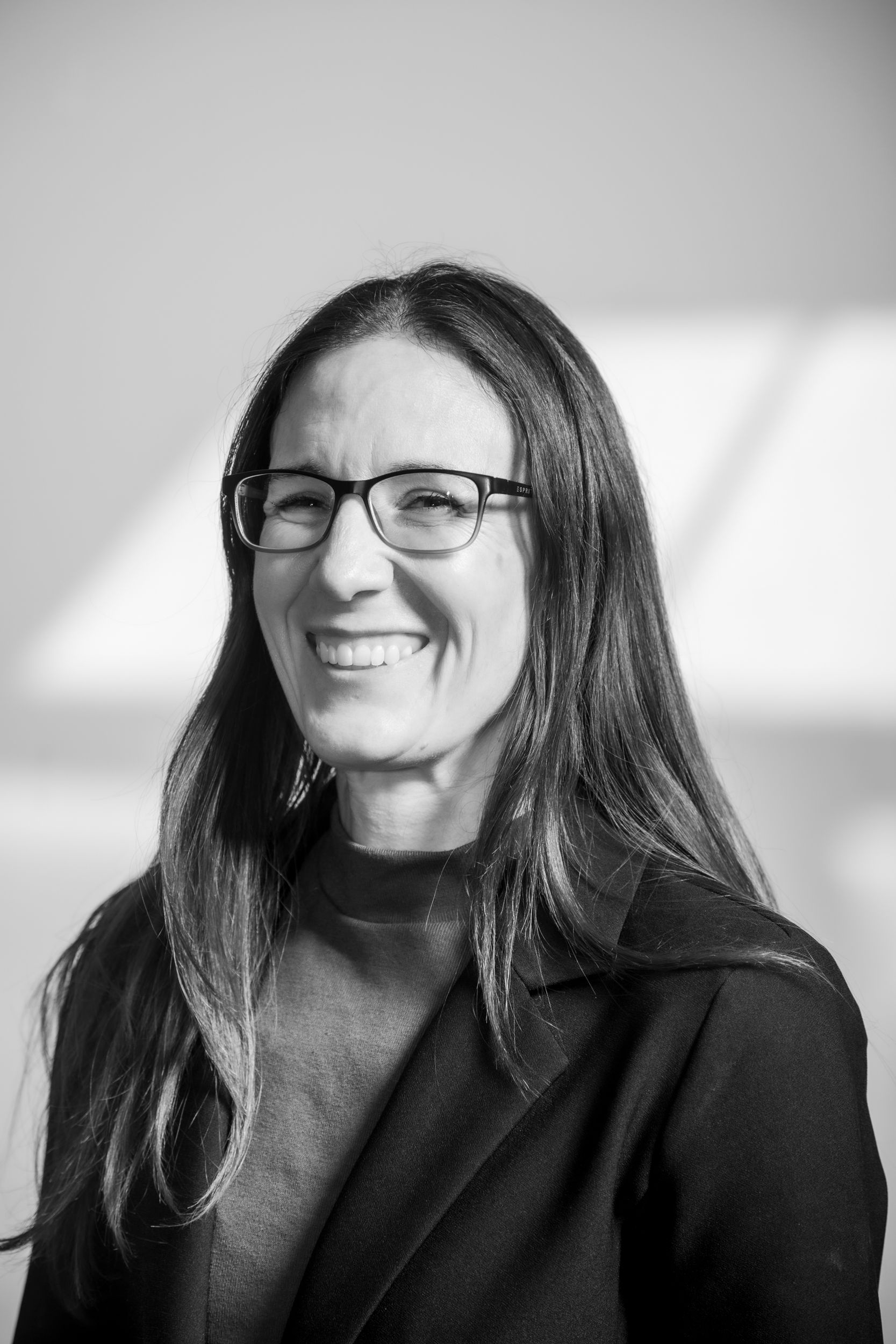 woman smiling with glasses on