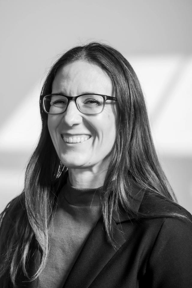 woman smiling with glasses on