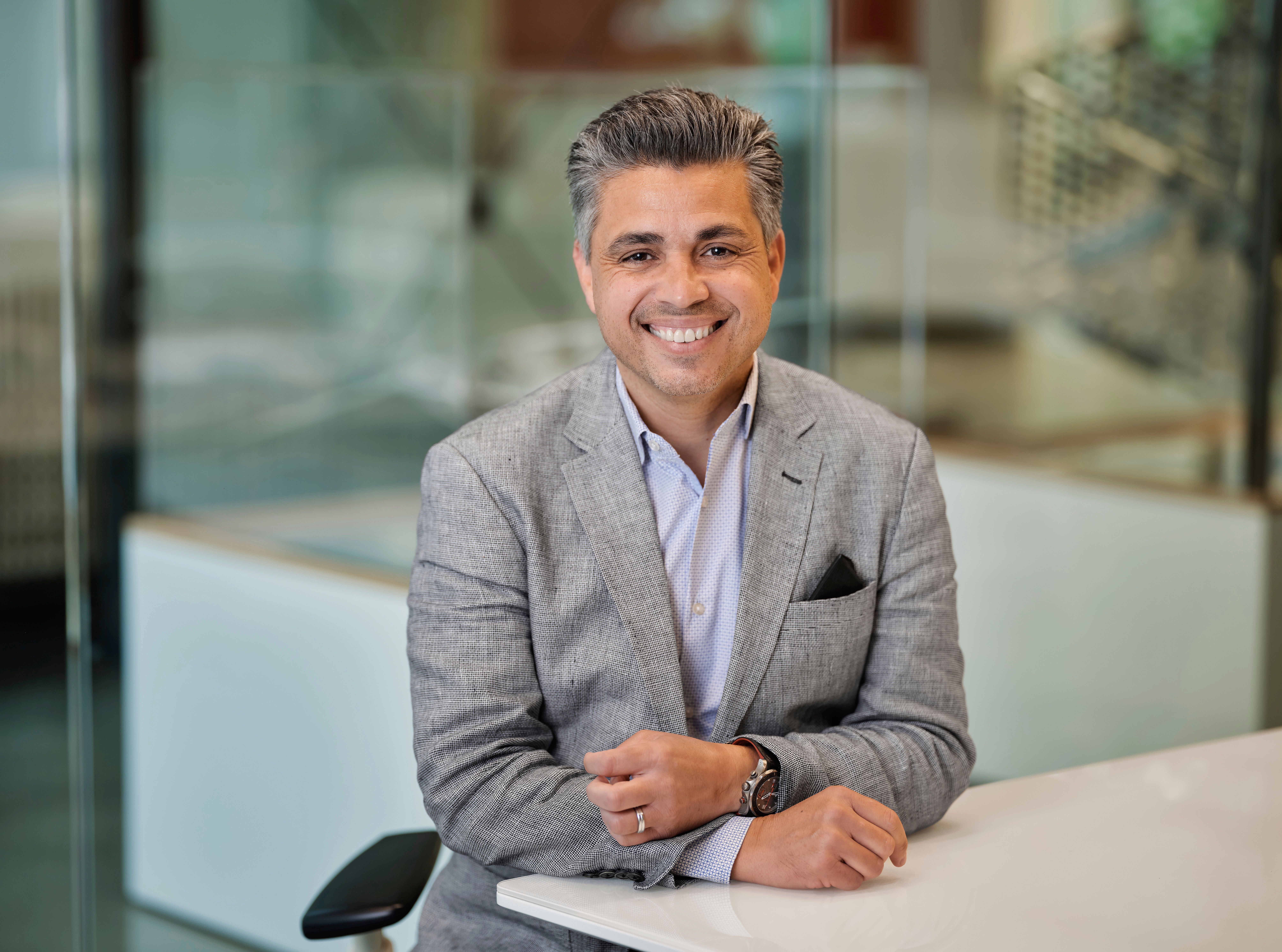 Eddie Abeyta sitting at drafting table