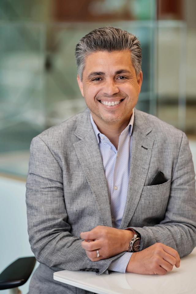 Eddie Abeyta sitting at drafting table