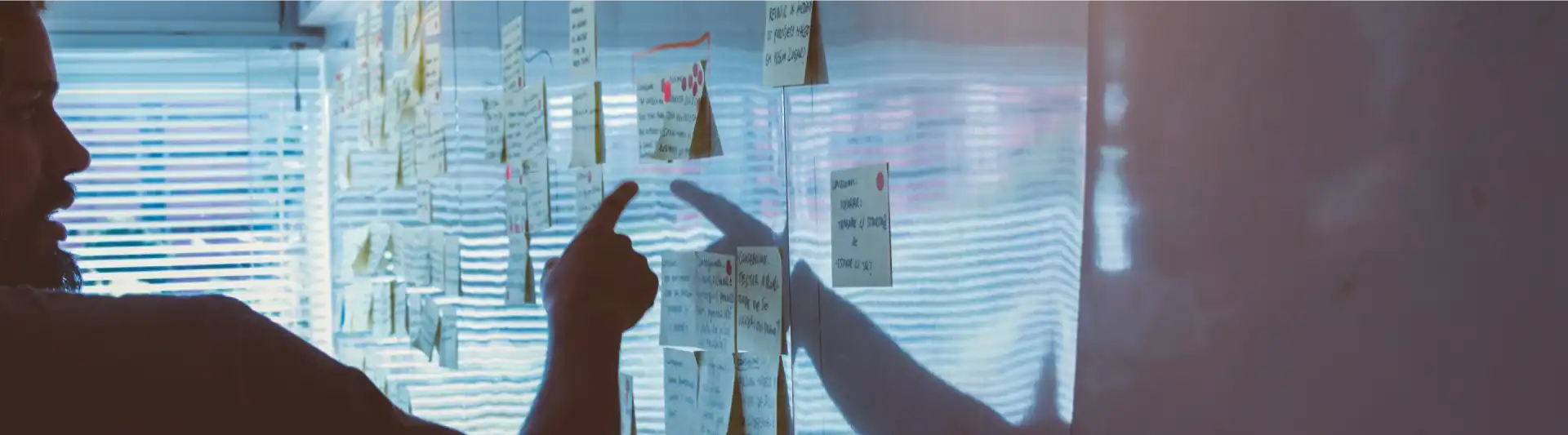 guy pointing at sticky notes