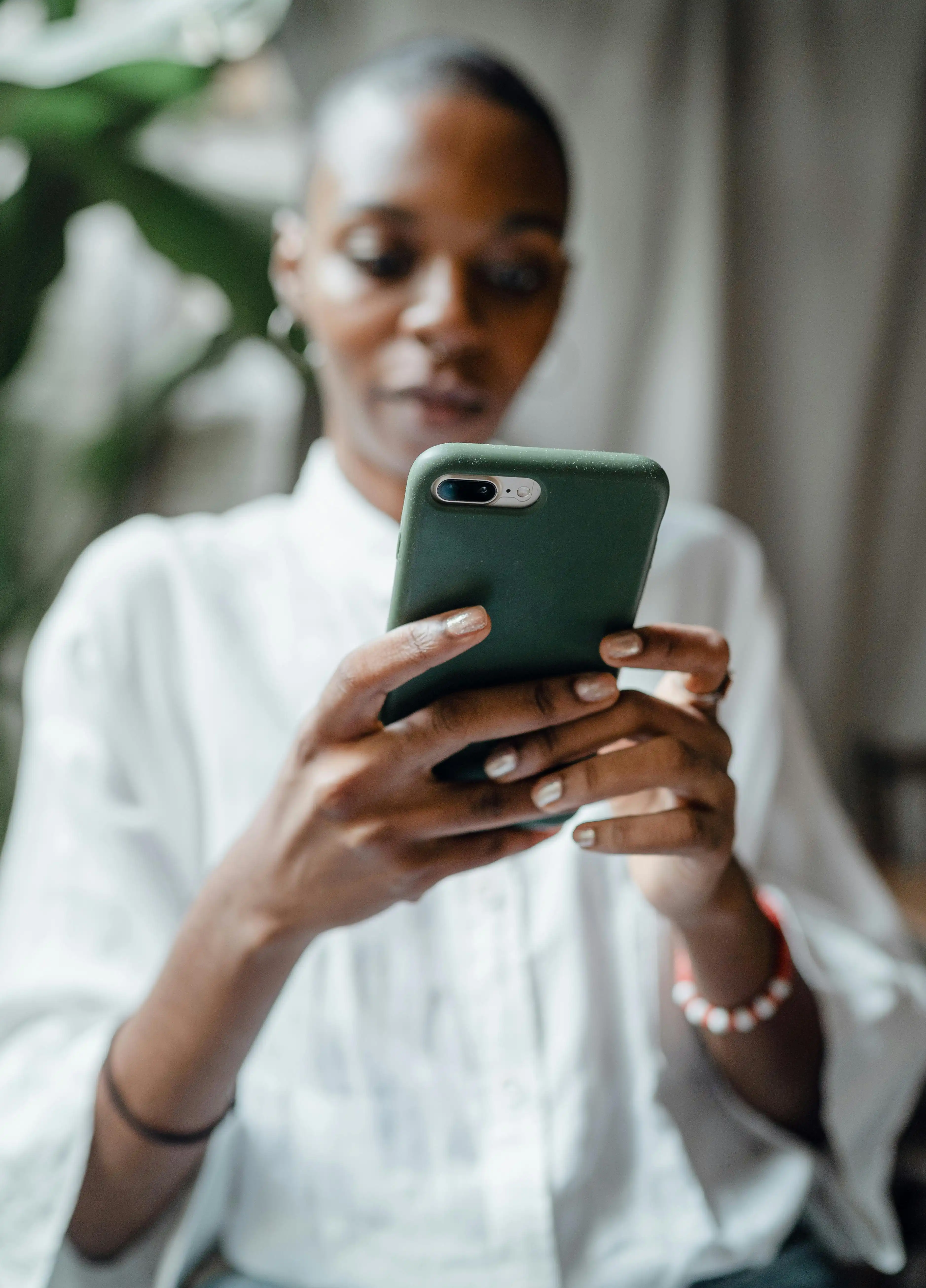 Woman typing on her phone