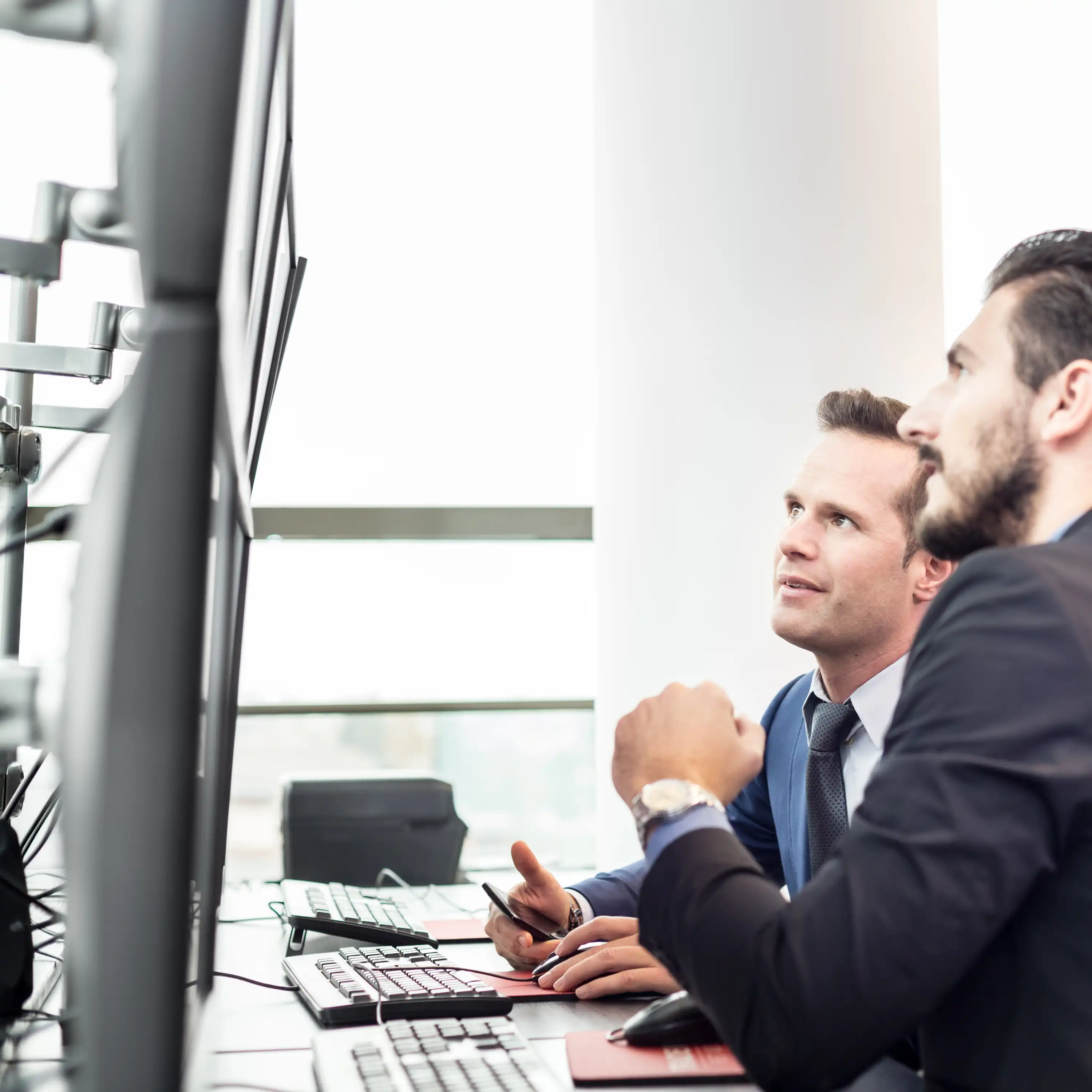 men looking at screen