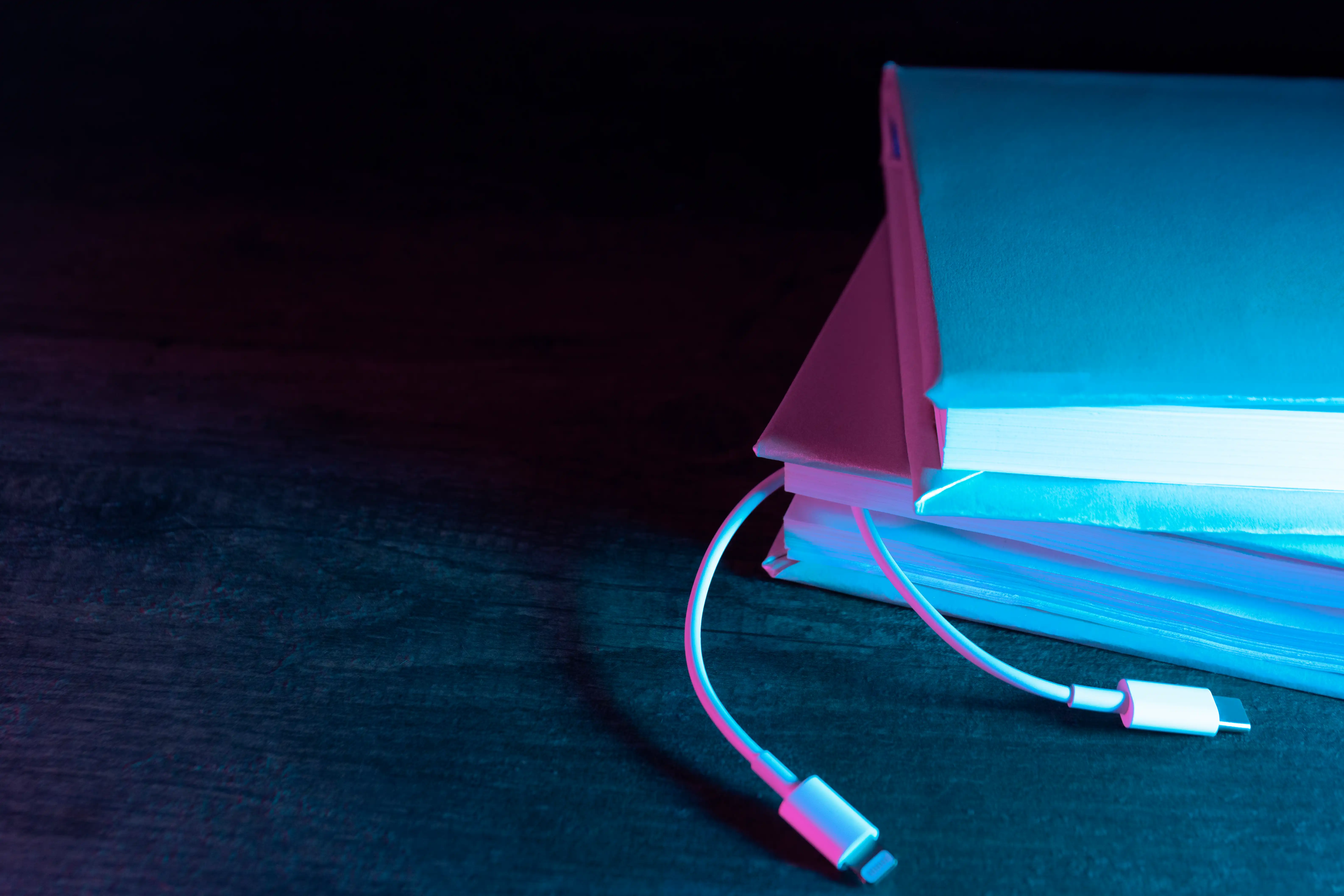 stack of books with power cords