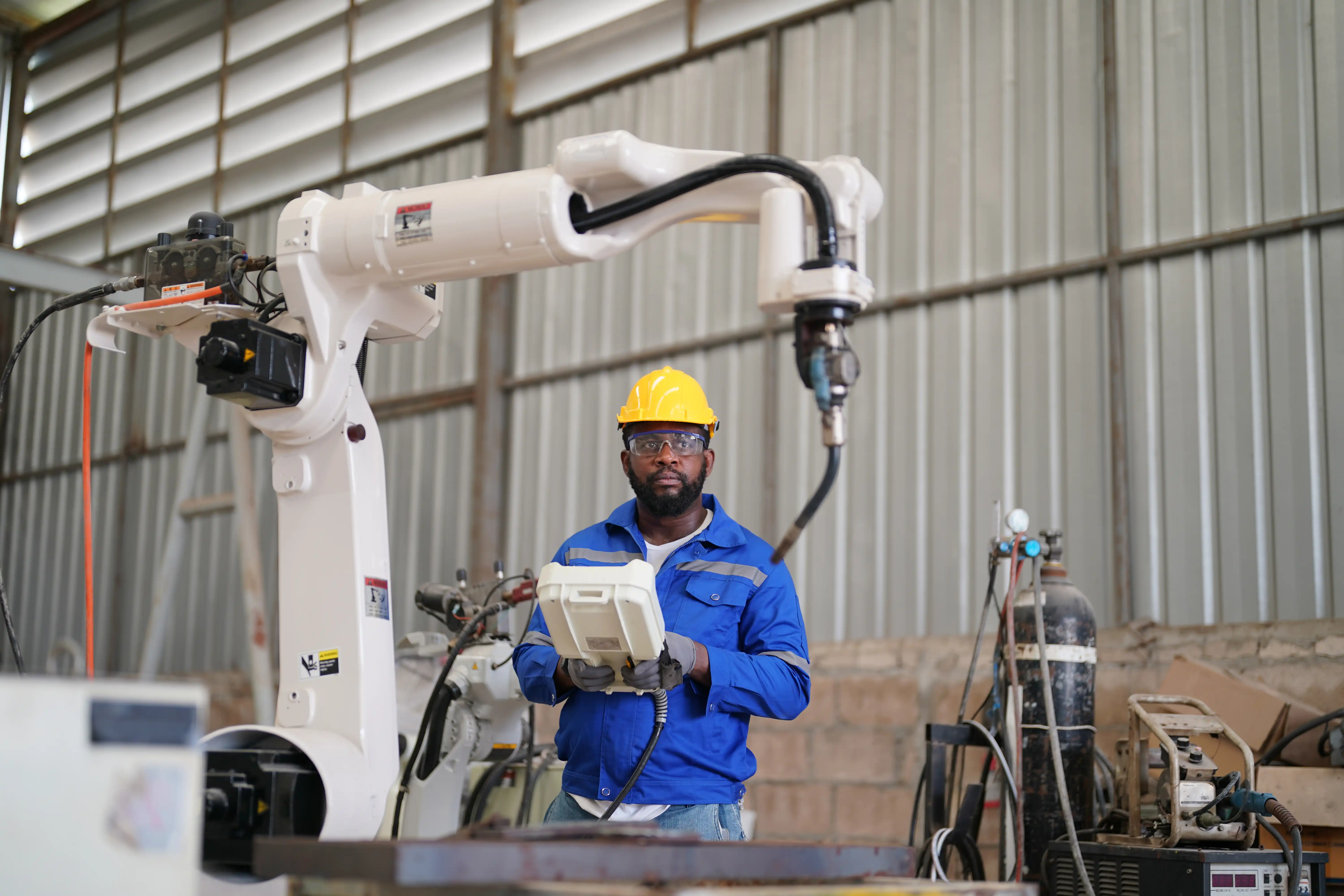 automated arm working in factory setting