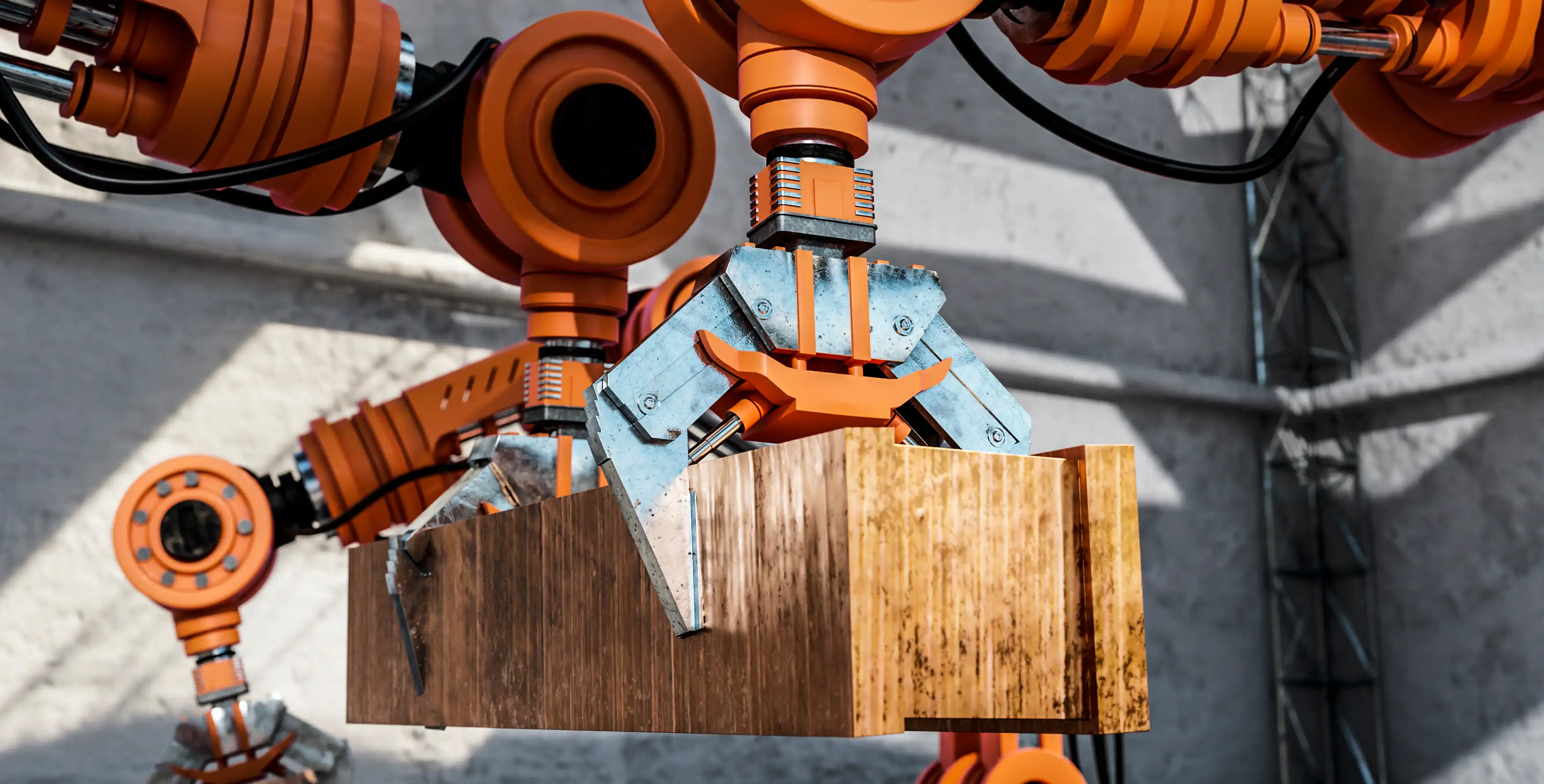 orange industrial robotic arms holding a plank of wood