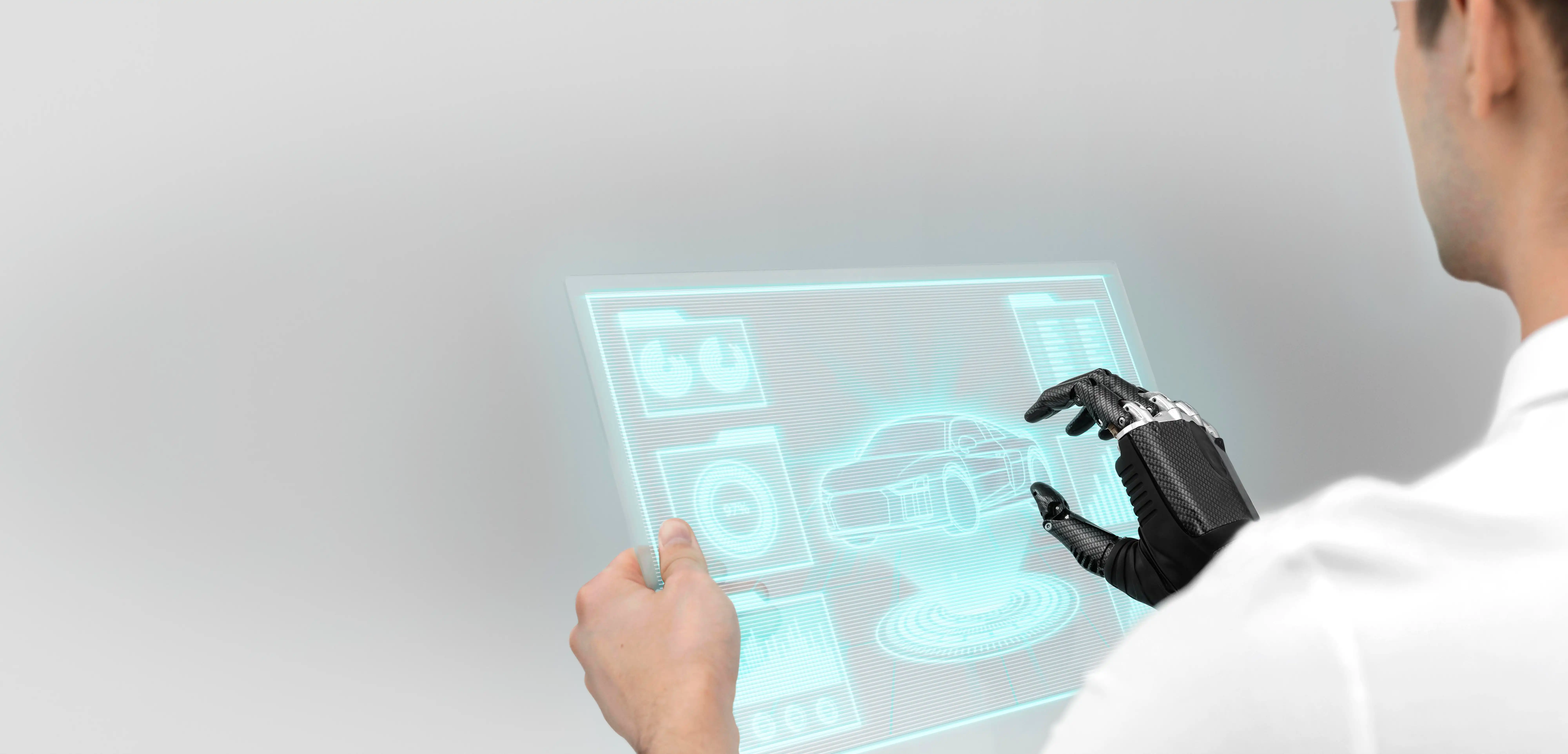 Man operating on screen showing automobile data