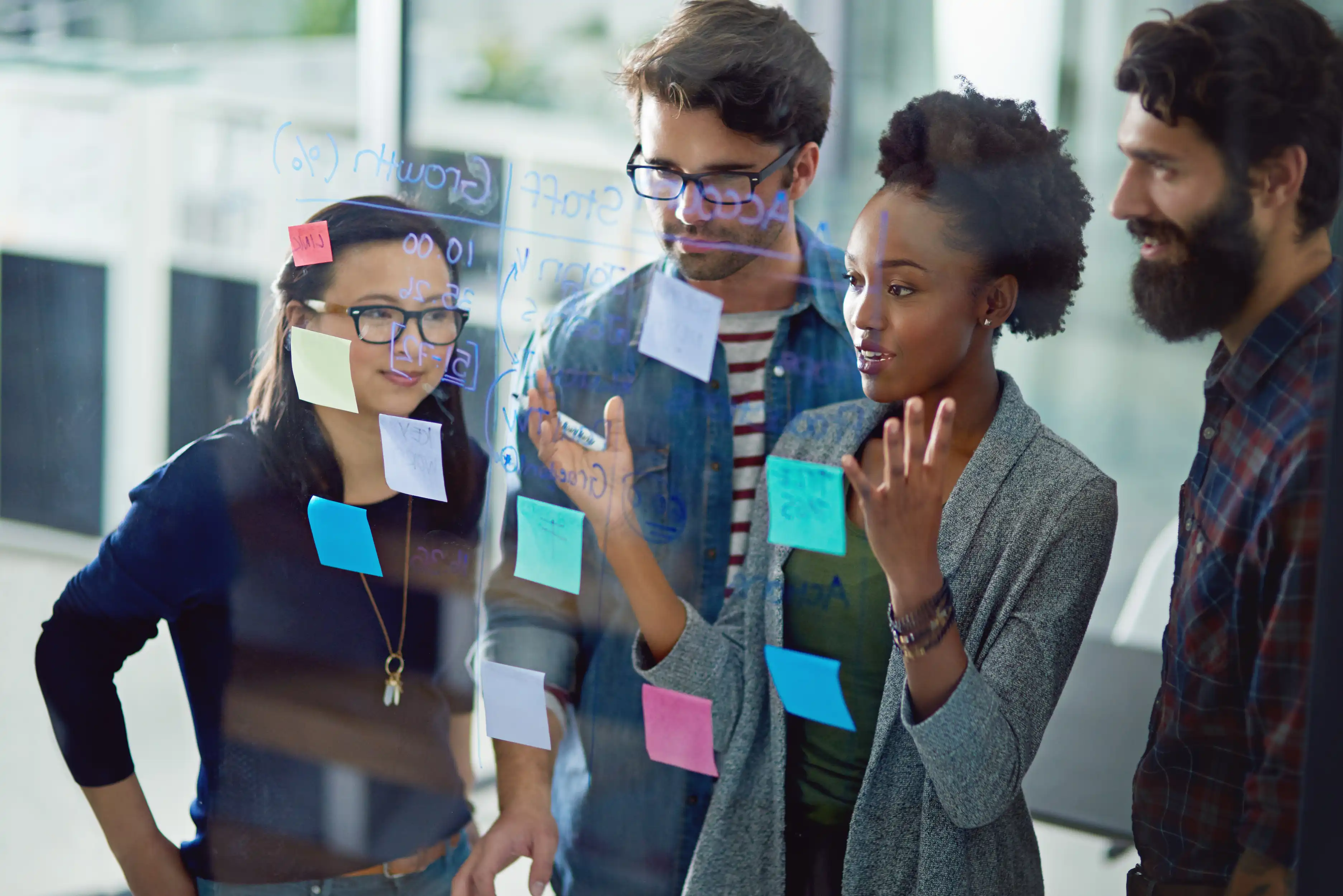 people using strategy on whiteboard