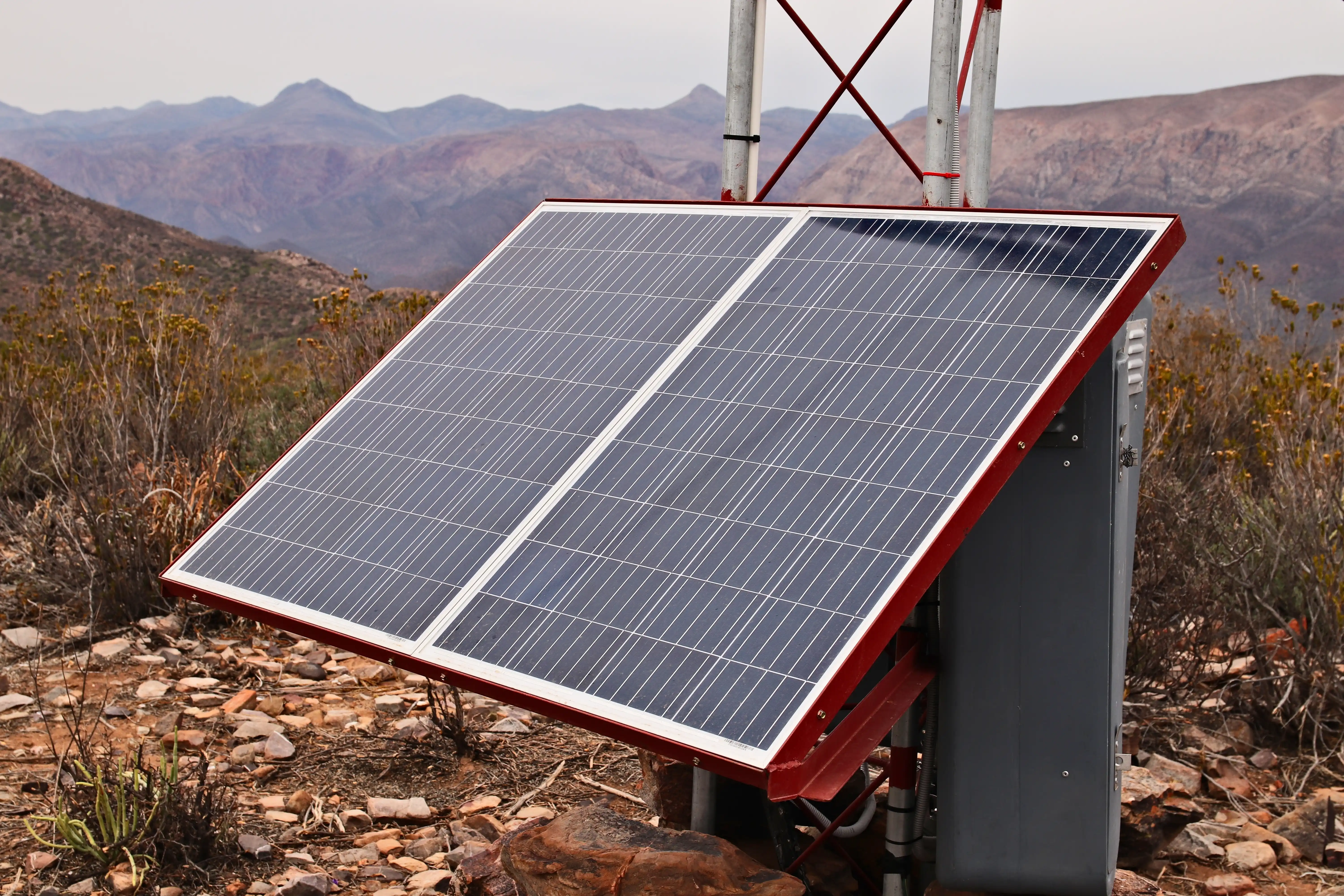 solar power panel attached to a tower's support poles