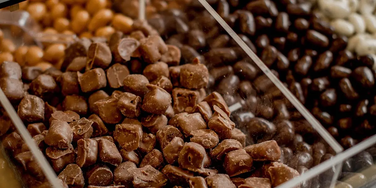 Bulk chocolate displayed in retail bins, the kind stocked by Chennai wholesalers