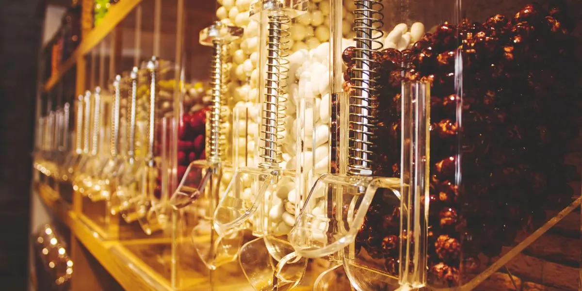 Premium bulk confectionery dispensers in a retail store, as used in Kerala supermarkets
