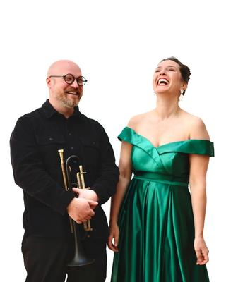 Two happy performers, a trumpeter and a soprano