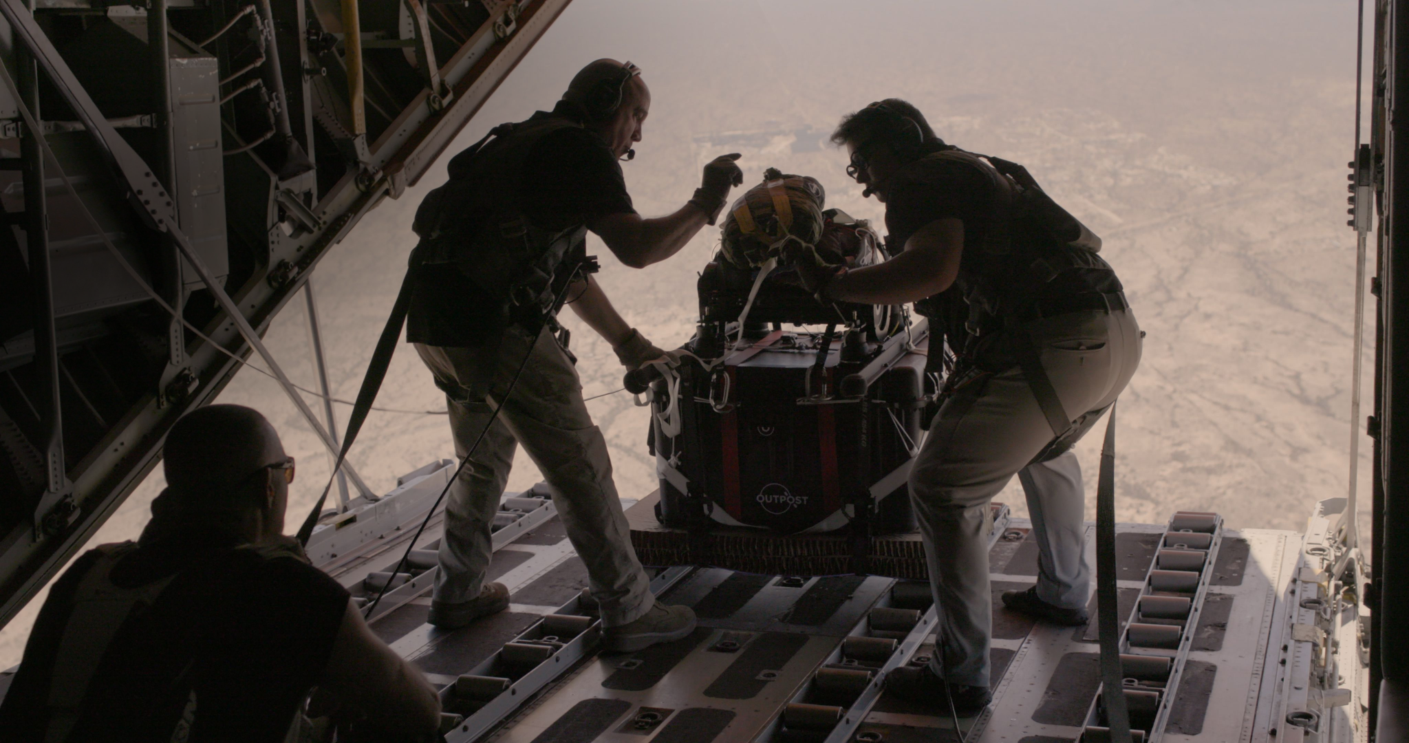 Flight crew prepares to drop AirDrop from a c-130
