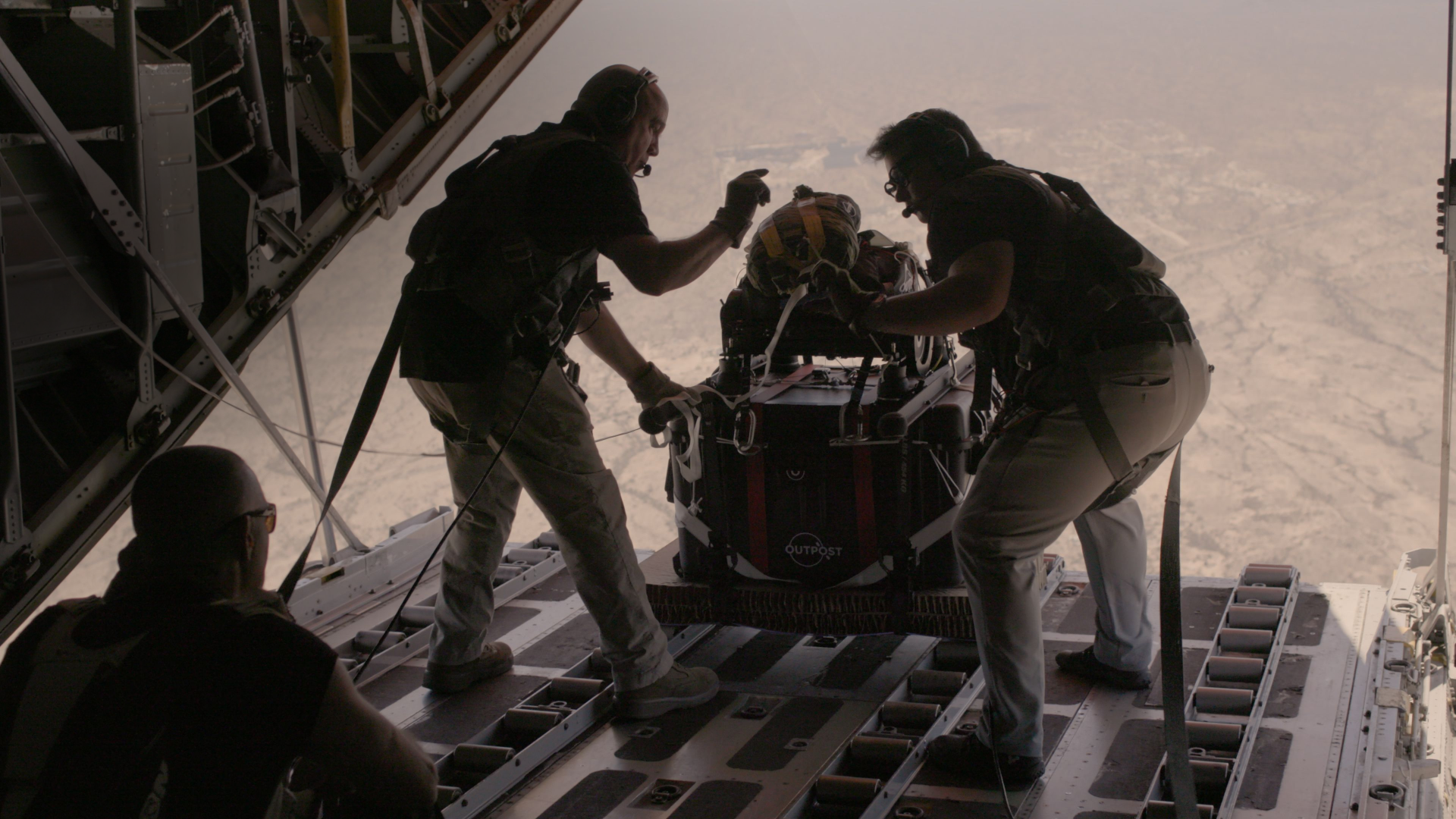 Flight crew prepares to drop AirDrop from a c-130