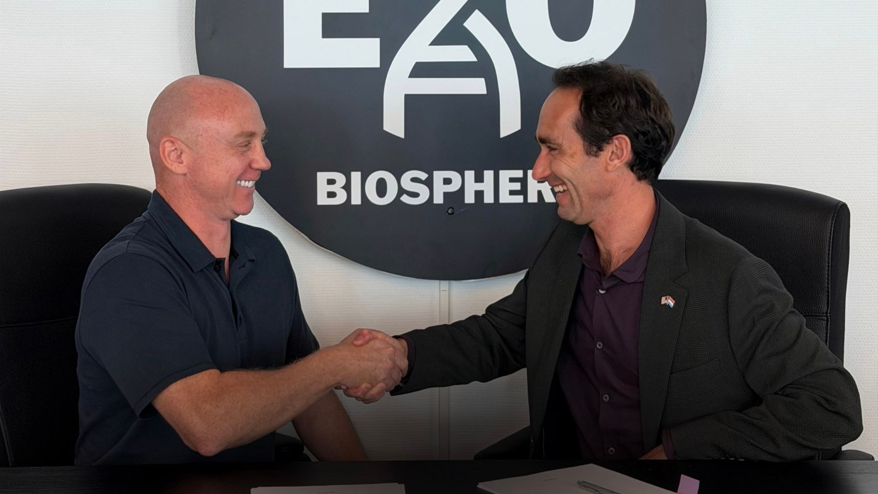 Exobiosphere and Outpost leadership shaking hands