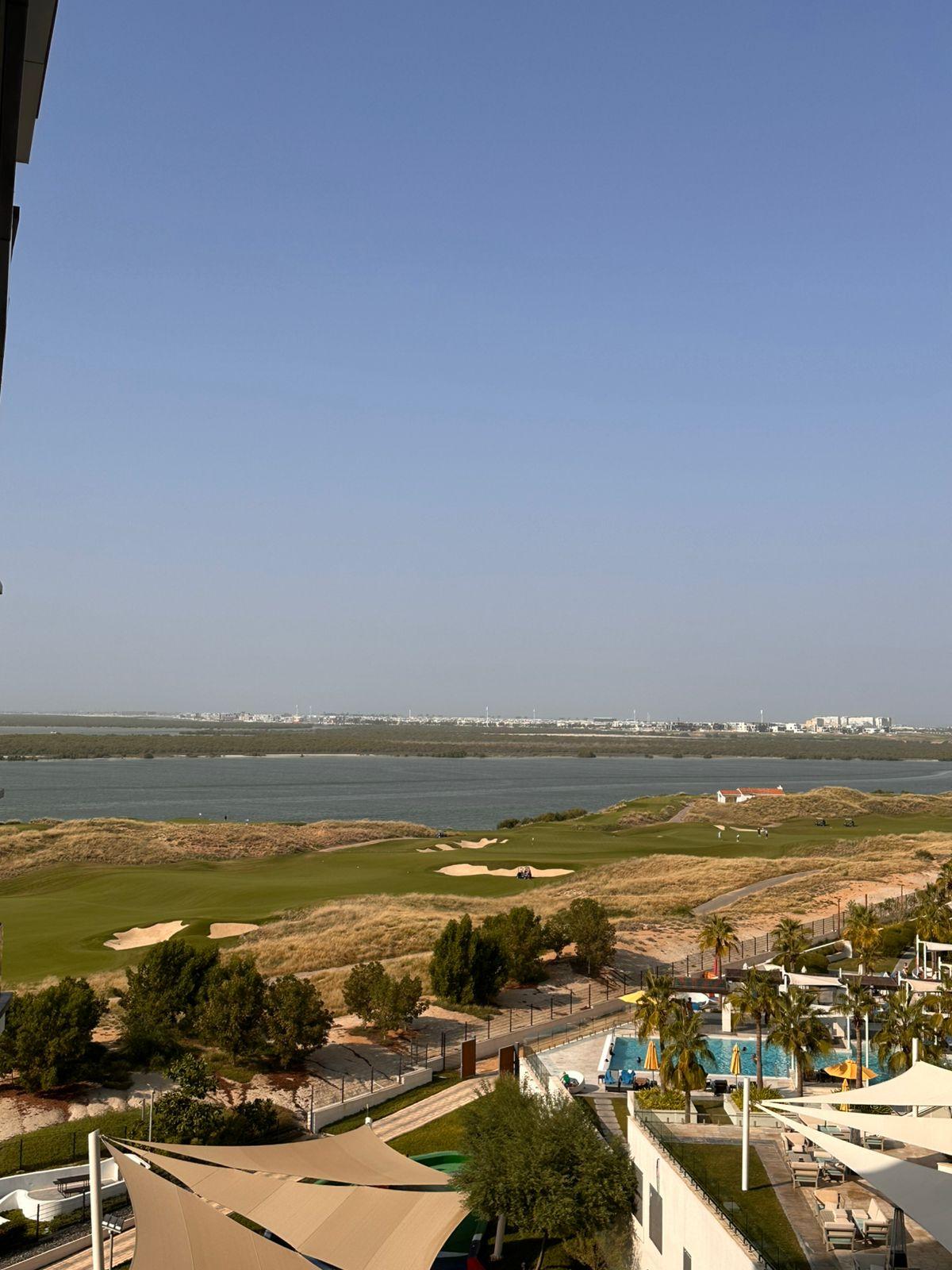 View from the balcony over Yas Links golf course to the sea