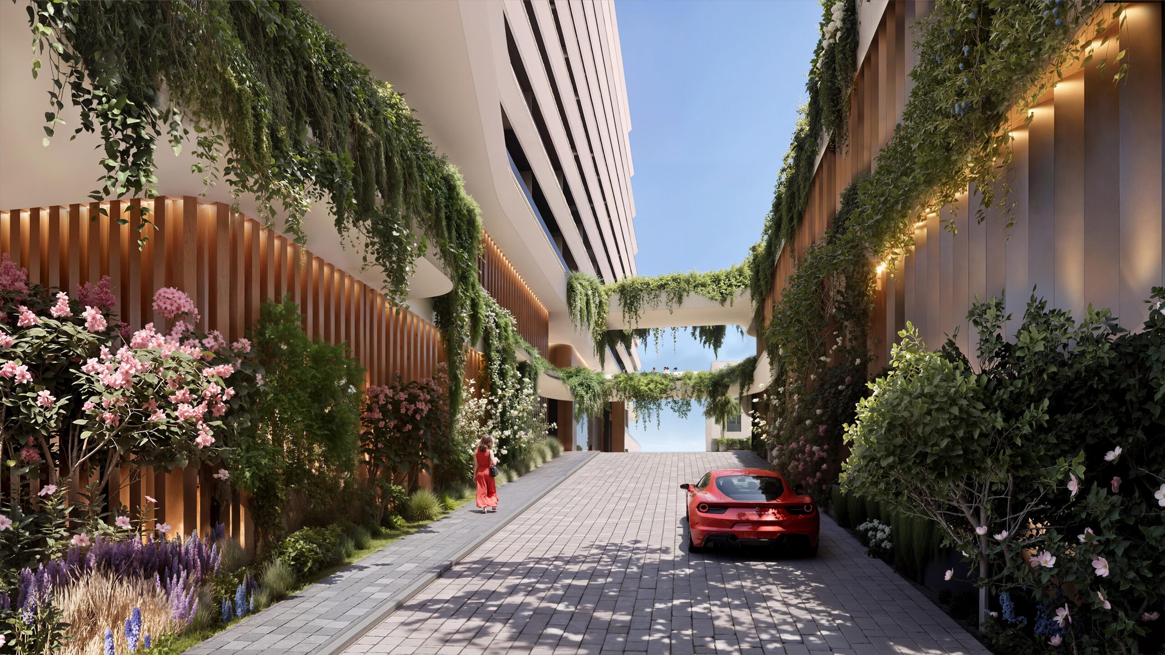 Planted arrival avenue between the buildings