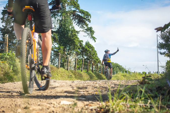 Two electric cyclists traveling at a safe distance