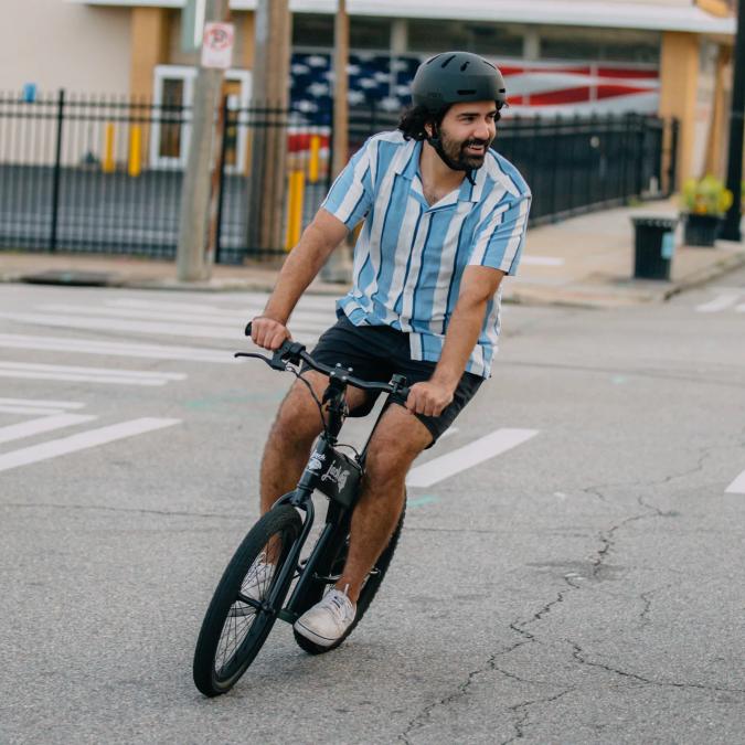 man wearing a helmet riding an ebike