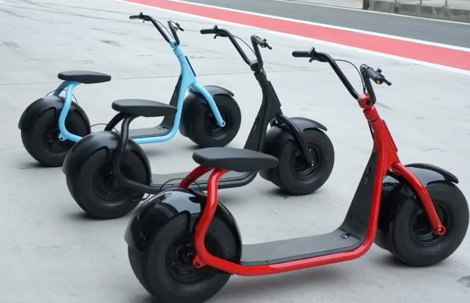 Electric scooters parked in a row