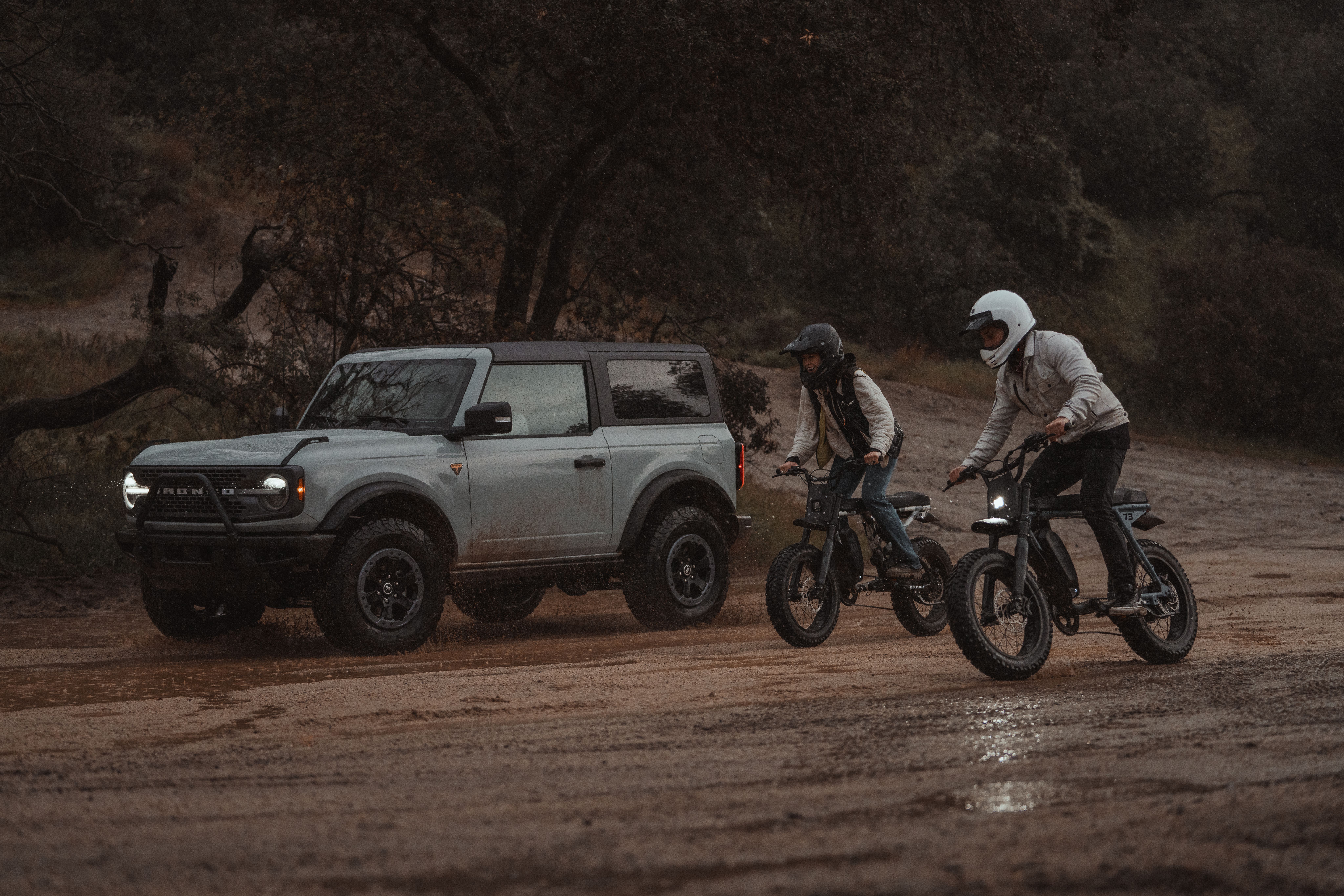 Electric Bikes and a SUV exploring in the mud