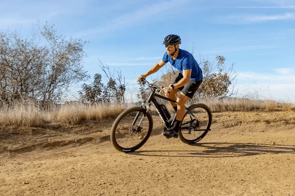 Mountain biker riding on trail in desert