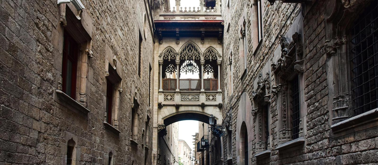 Narrow medieval streets and stone archways in the Gothic Quarter